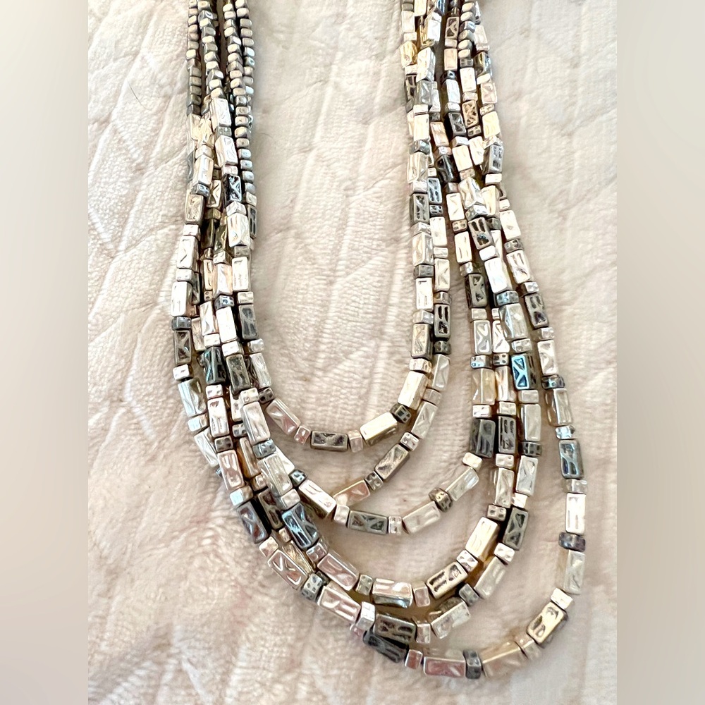 Multi layer silver tone necklace